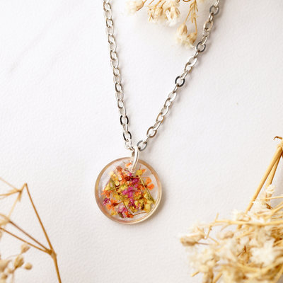 Real dried flowers in resin necklace, small silver circle in yellow orange red