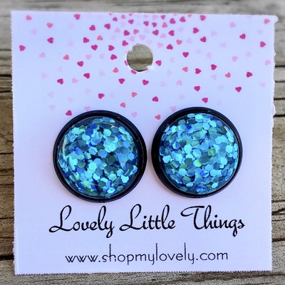 12mm blue glitter with black setting 