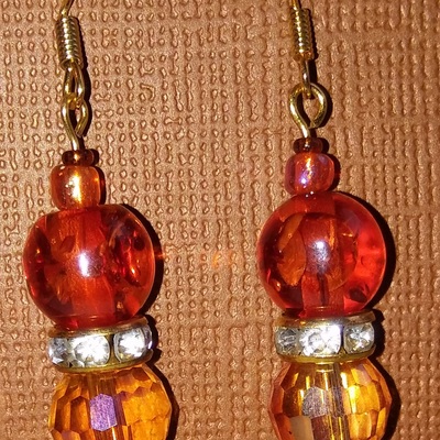 Dark and light orange glass faceted earrings