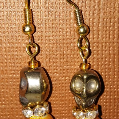 Double gold skull earrings