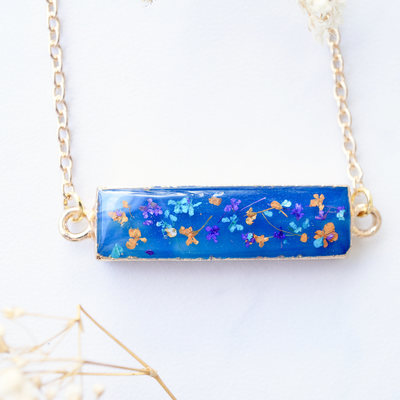 Real dried flowers and resin necklace, blue bar geode in purple blue orange and gold
