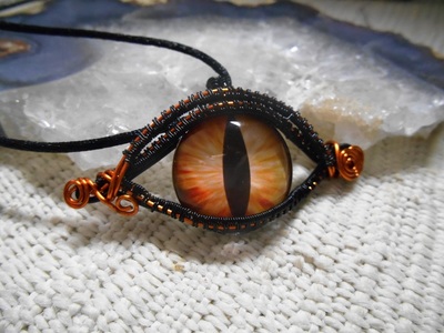 Orange and black dragons eye necklace