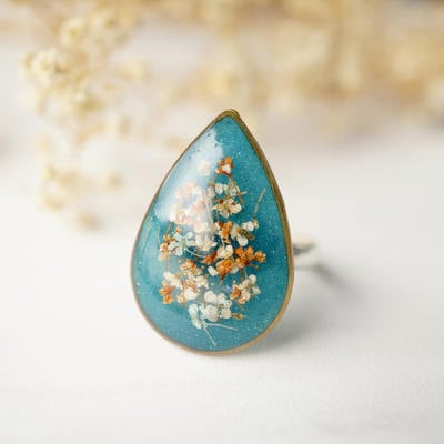 Real pressed flower and resin ring in gold, teal orange white and mint