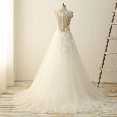 Sleeveless lace appliqué sweep train wedding dress with plunging sweetheart neckline