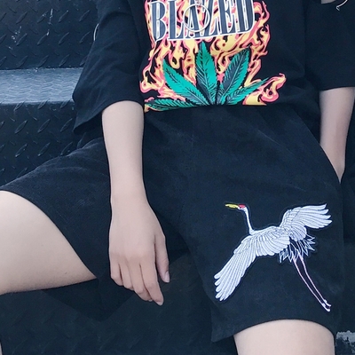 Crane embroidered shorts