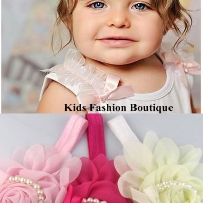 Baby, toddler, girls headbands adorned with pearls.