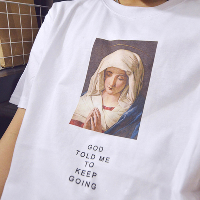 "GOD TOLD ME TO KEEP GOING" T SHIRT