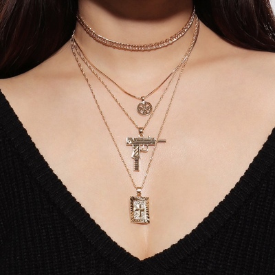 Cross and gun multi layer necklaces