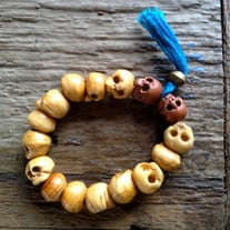 Carved wood skull bracelet