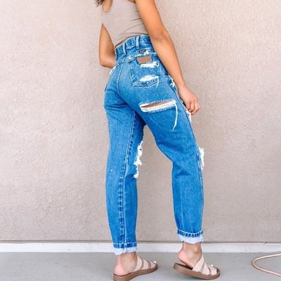 Women's fashion denim with ripped holes pants