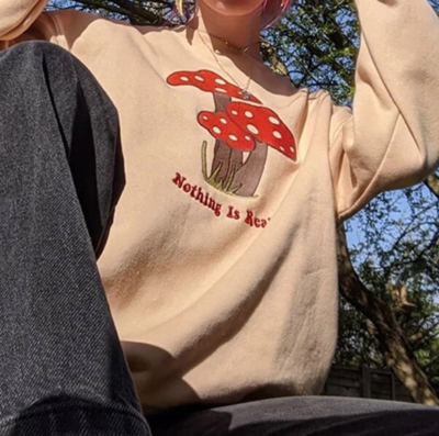 "NOTHING IS REAL" MUSHROOM SWEATSHIRT