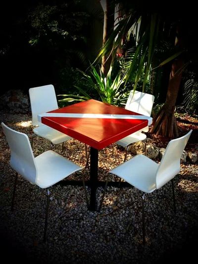Dive Flag Dining Table with four white chairs