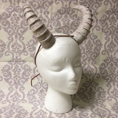 Bone white ridged horns